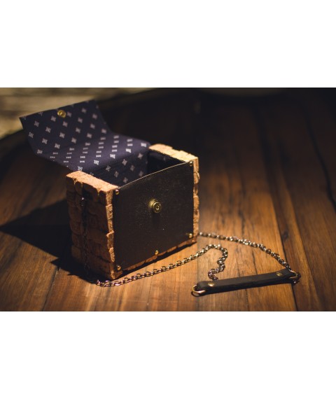Designer clutch bag made of leather and champagne cork.