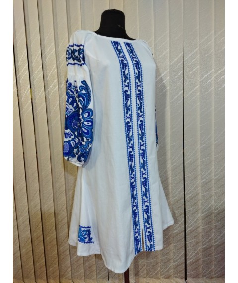 Youth dress embroidered with beads on home-woven white fabric