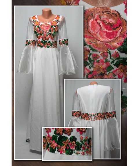 Elegant wedding dress embroidered with beads.