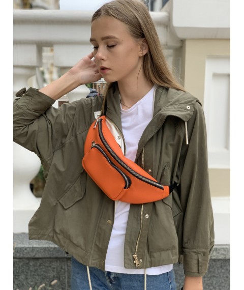 Women's orange belt bag with a patch pocket made of eco-leather