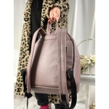 Medium size urban women's backpack with diagonal pocket in faux leather matte lilac