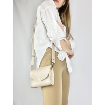 Fashionable women's clutch belt bag with two belts made of eco-leather beige