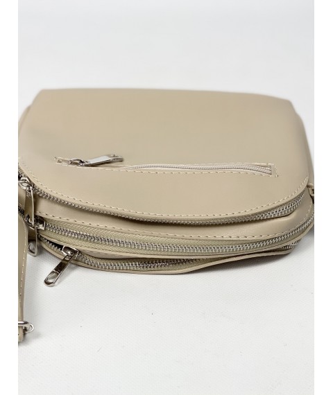Women's laconic bag with three compartments and a back pocket with a long strap made of eco-leather light beige