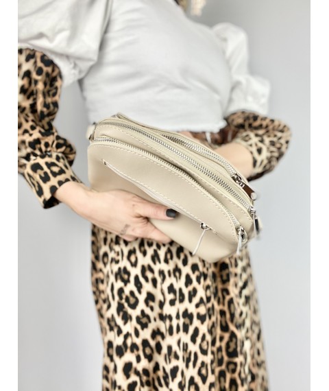 Women's laconic bag with three compartments and a back pocket with a long strap made of eco-leather light beige