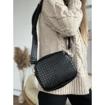 Black women's bag made of eco-leather of a rectangular shape with a wide long handle black wicker
