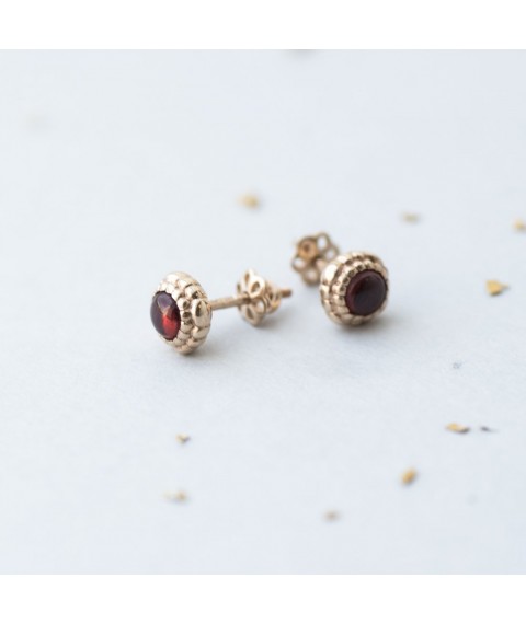 Gold stud earrings with pyrope s05216 Onyx