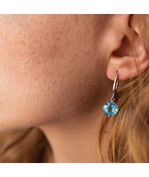 Gold earrings "Attraction" with blue topaz s08003 Onyx