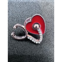 Medical jewelry (stethoscope with a red heart).