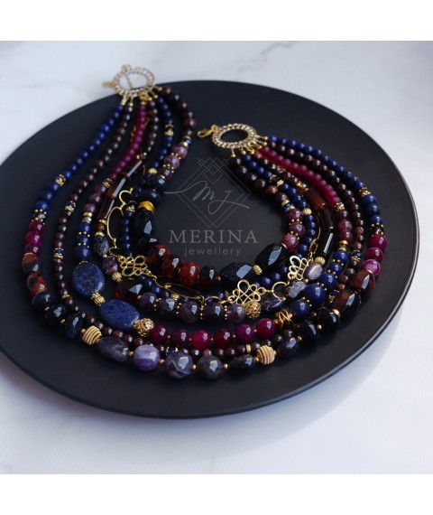 Berry juice. A necklace of lapis lazuli, agate, amethyst, quartz
