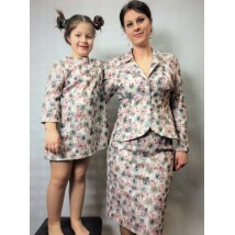 Suit for mother and dress for daughter made from the same materials