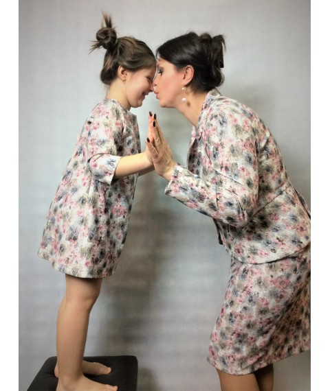 Suit for mother and dress for daughter made from the same materials