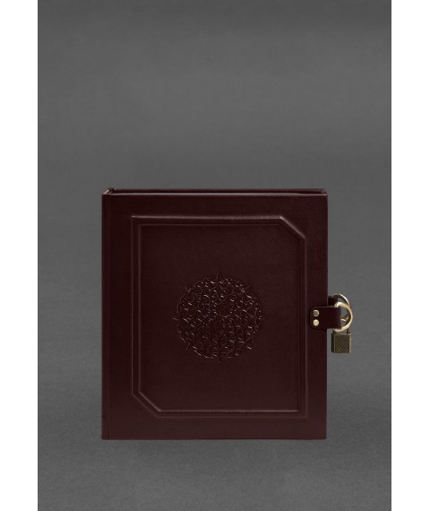 Photo album in leather cover with burgundy lock