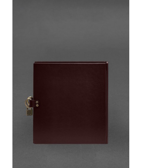 Photo album in leather cover with burgundy lock