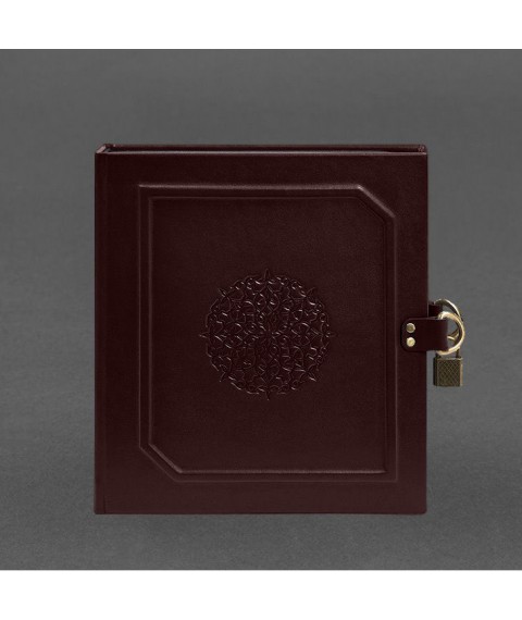 Photo album in leather cover with burgundy lock